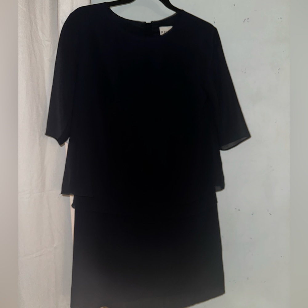 Navy blue midi dress with pleated bottom.